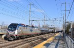 Amtrak Train # 195 being pulled by Sprinter # 656 passing a stopped Amtrak Train # 164